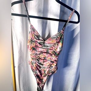 Floral, pink, and green bodysuit extra small